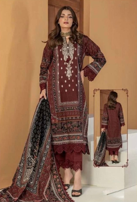 A masterpiece of deep maroon, delicate embroidery, and traditional motifs